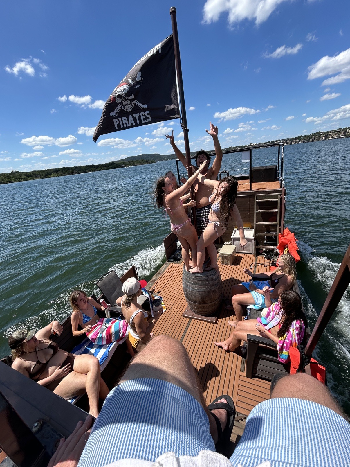 A party aboard the pirate ship beneath the Possum Kingdom Pirates flag
