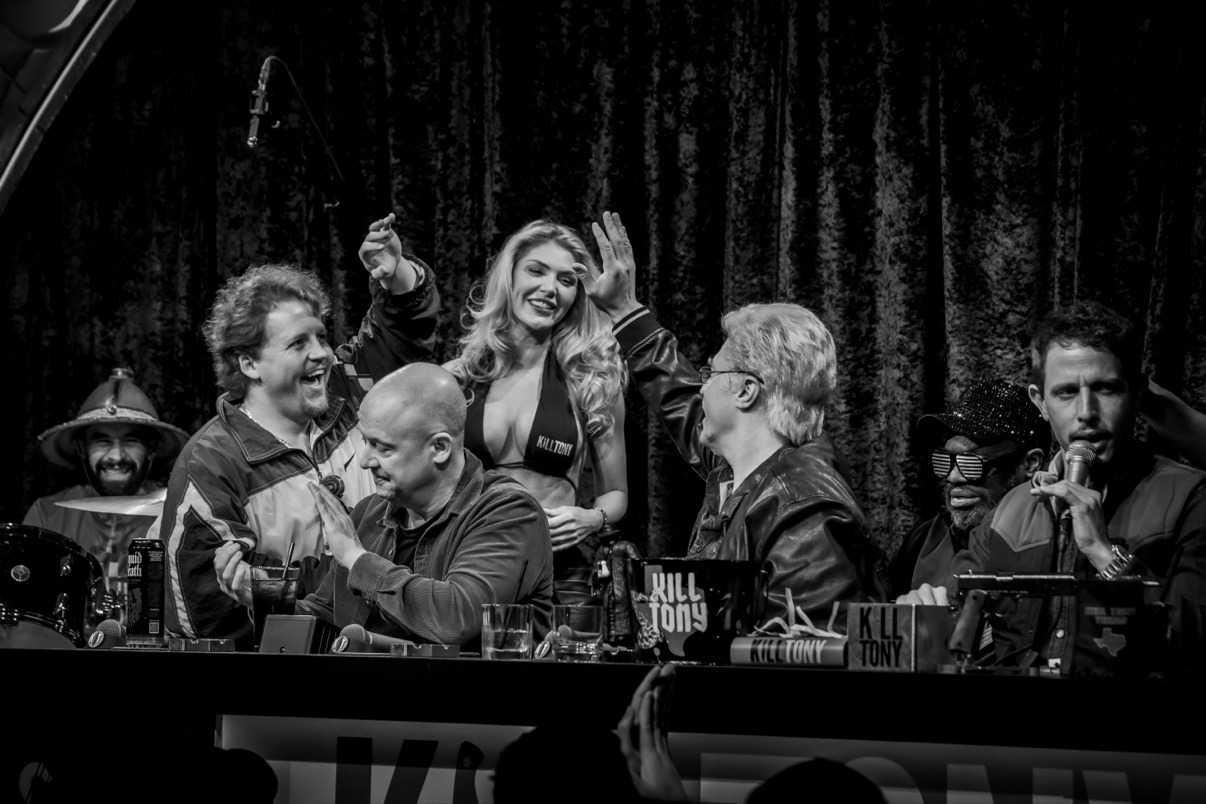 Jake celebrating with the Kill Tony cast onstage