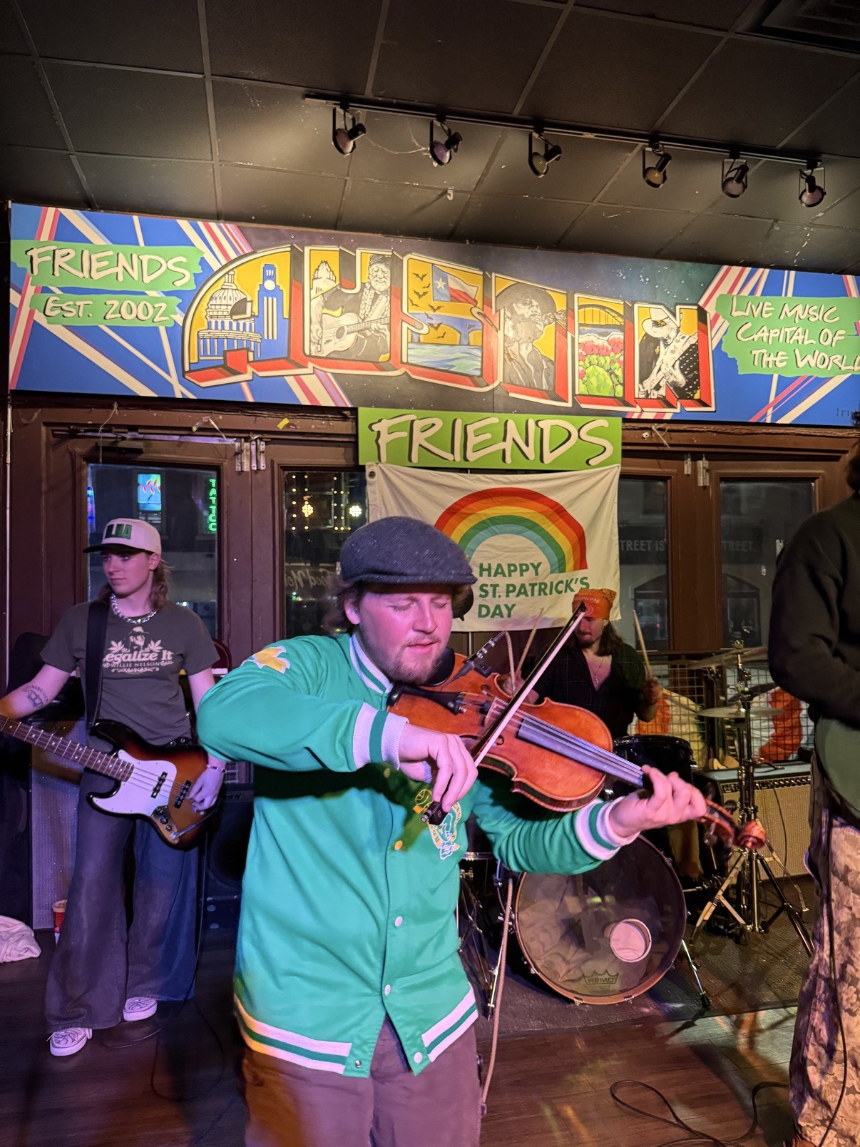 Jake playing fiddle onstage in Austin on Saint Patrick's Day
