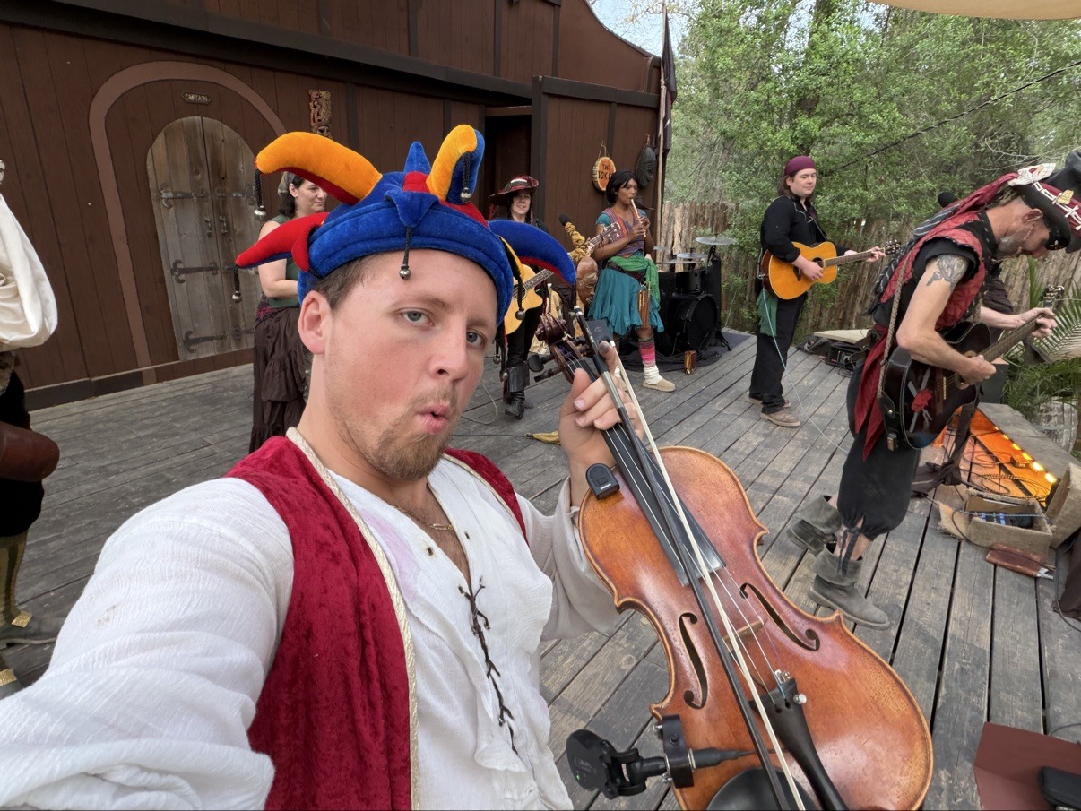 Jake with friends in costume at a pirate festival